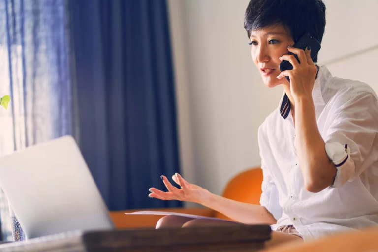 Woman at home talking on a phone